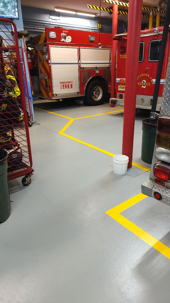 Fire station grey epoxy floor with yellow lines — Jefferson Twp, NJ