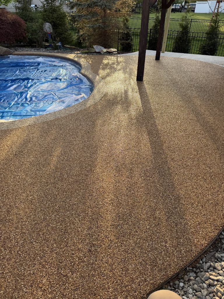 Pool deck river rock aggregate coating wide view — Central NJ